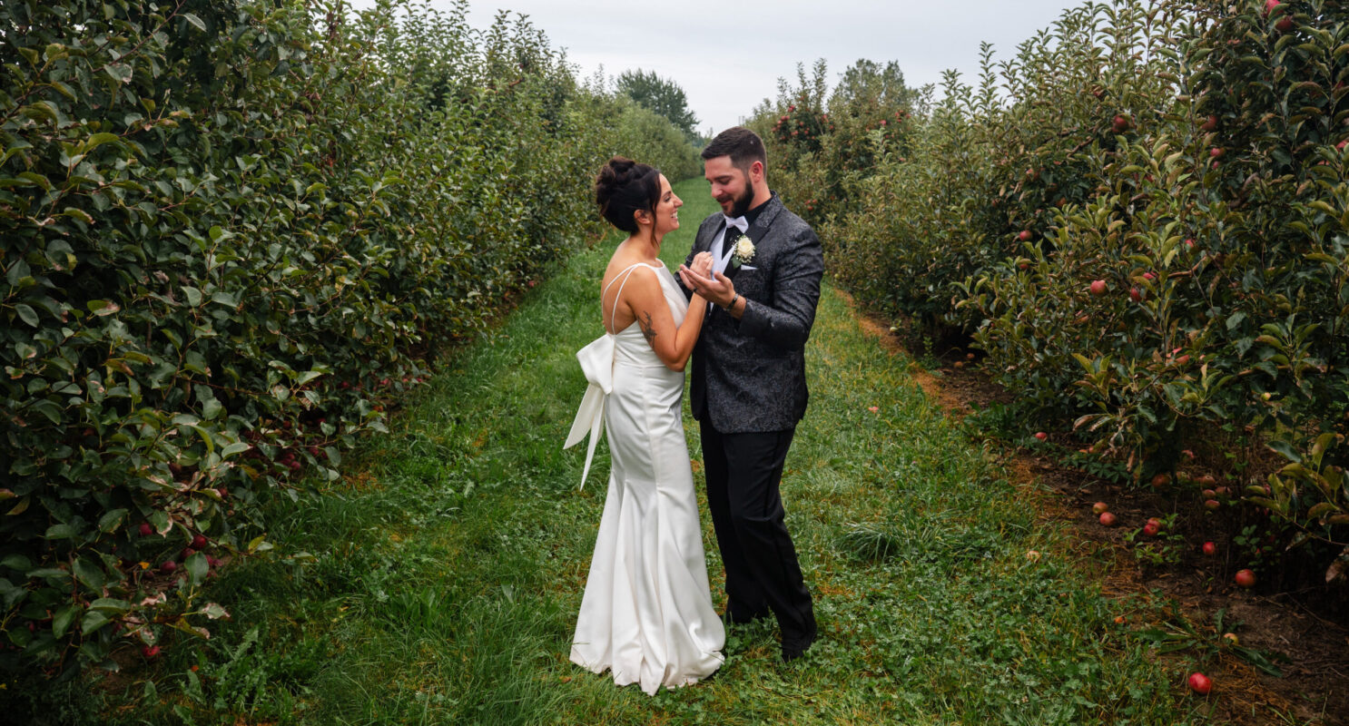 Rochester Wedding Photographer - Bride and Groom dancing in apple orchard